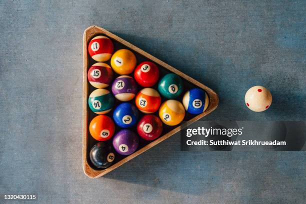 directly above shot of old pool balls on table - pool cue sport stock pictures, royalty-free photos & images