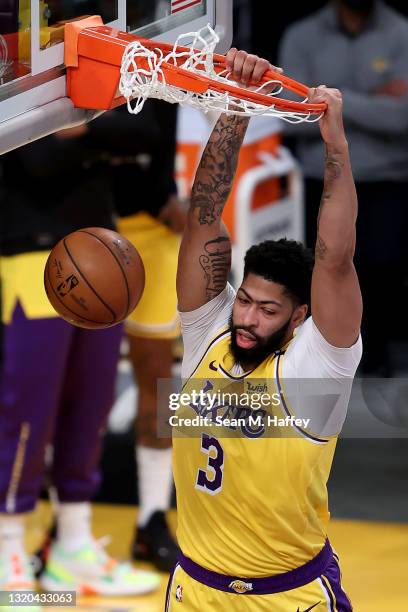 Anthony Davis of the Los Angeles Lakers dunks the ball during the second half of Game Three of the Western Conference first-round playoff series...