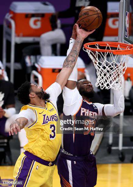 Anthony Davis of the Los Angeles Lakers blocks a shot by Jae Crowder of the Phoenix Suns during the second half of Game Three of the Western...