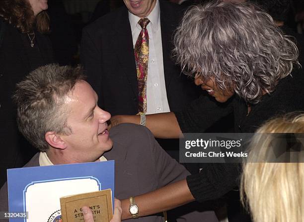 Actor Tim Robbins, recipient of the "Upton Sinclair Award," and actress Alfre Woodard mingle at the Liberty Hill Foundation''s annual Upton Sinclair...