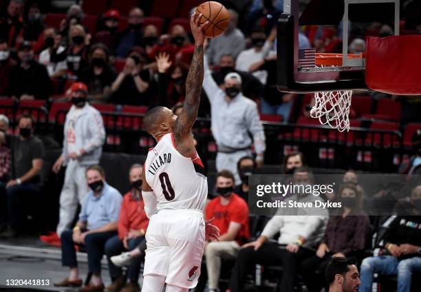 Damian Lillard of the Portland Trail Blazers goes up for a dunk during the first half of Game Three of the Western Conference first-round playoff...