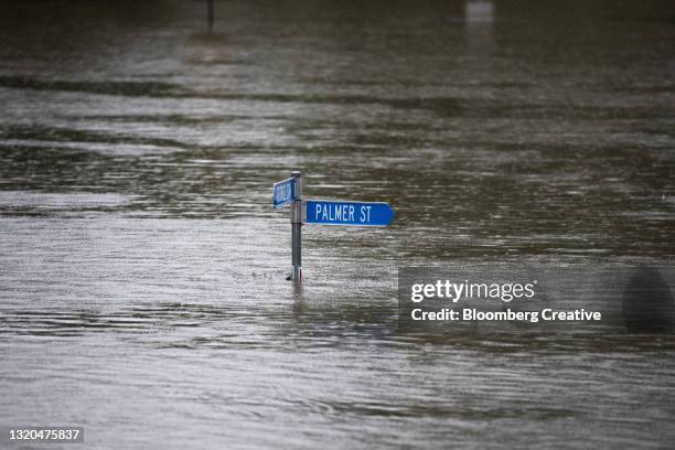 street sign in floodwater - flood bildbanksfoton och bilder