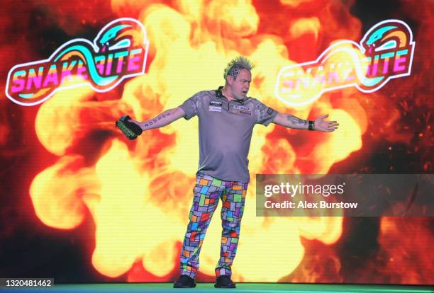 Peter Wright of Scotland walks out ahead of his match against Michael van Gerwen of The Netherlands during Night 16 of the Unibet Premier League...