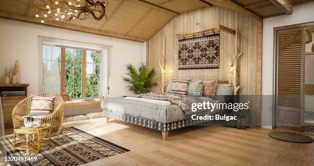 cozy ethnic master bedroom - rustic stock pictures, royalty-free photos & images