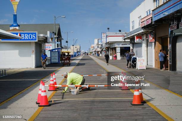 Repairs are done along the boardwalk the day before the Memorial Day weekend, the unofficial start of summer, in the shore community of Wildwood on...