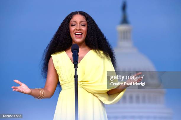 In this image released on May 28 Country music star and Grammy-nominee Mickey Guyton performing the national anthem on stage at the Capital Concerts'...