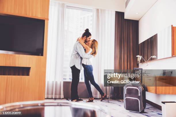 couple spending their valentines day at a luxury suite - emirati dance stock pictures, royalty-free photos & images