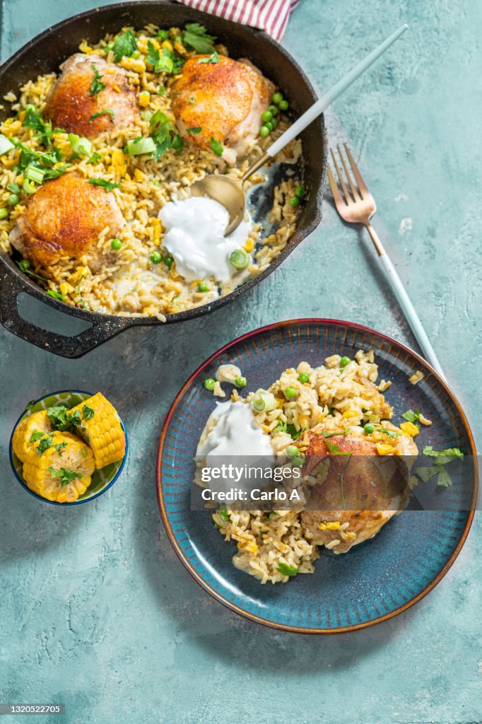 Chicken and curry rice in a skillet