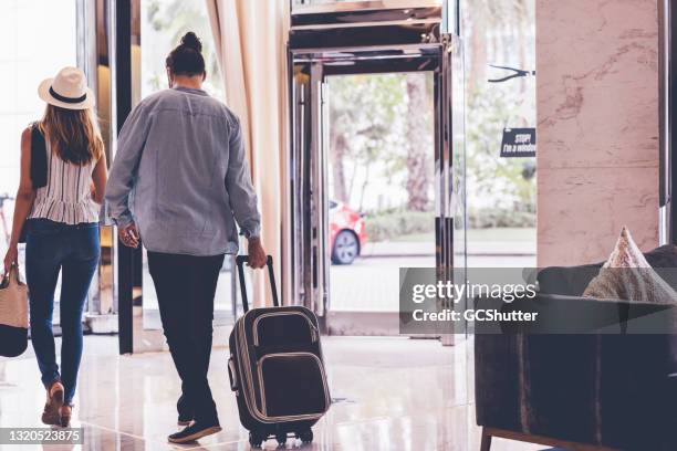 couple departing at a luxury hotel after their staycation - girlfriend leaving stock pictures, royalty-free photos & images