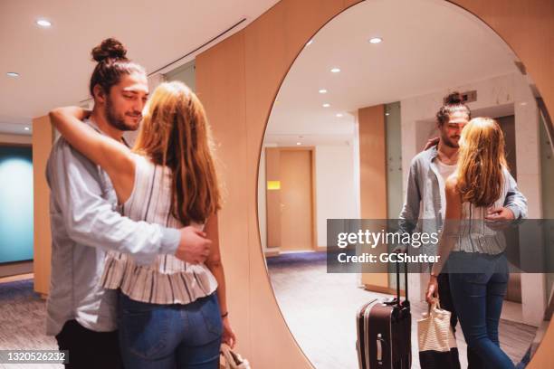 couple on honeymoon arriving at their hotel suite floor - emirati dance stock pictures, royalty-free photos & images