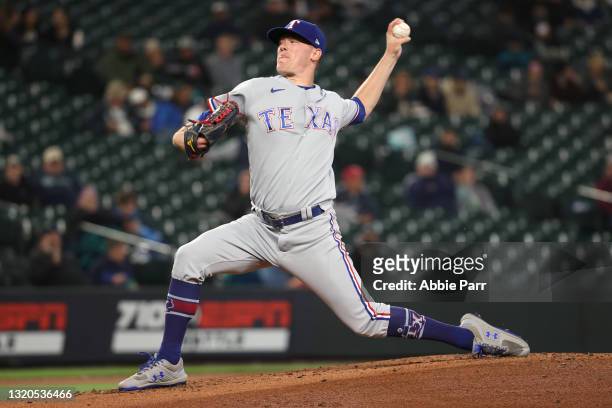 Kolby Allard of the Texas Rangers pitches during the first inning against the Seattle Mariners at T-Mobile Park on May 27, 2021 in Seattle,...