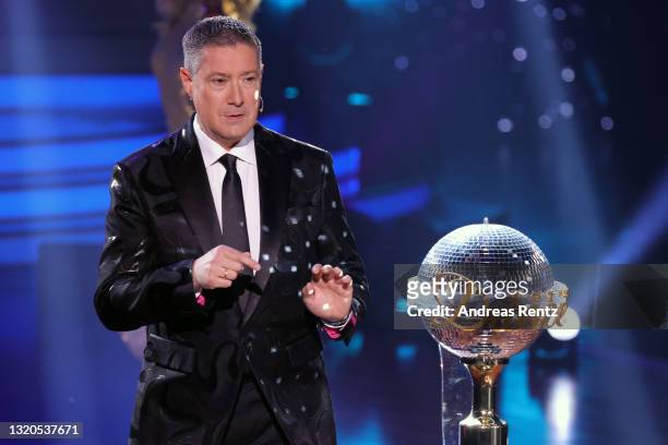 Juror Joachim Llambi is seen with the trophy on stage during the final show of the 14th season of the television competition "Let's Dance" on May 28,...