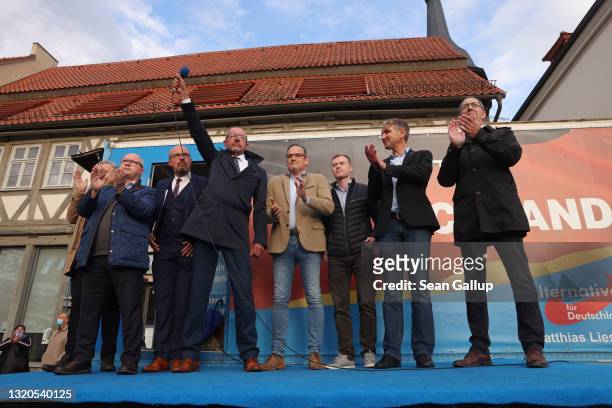 Far-right politician Bjoern Hoecke of the right-wing Alternative for Germany stands with regional AfD leaders and members after he spoke at an...