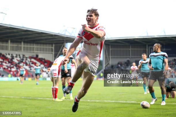 Jack Welsby of St Helens celebrates scoring his side's fifth try and his hat trick during the Betfred Super League match between St Helens and Hull...
