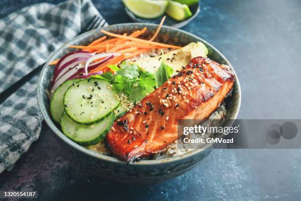 spicy salmon bowl with rice, carrots, cucumber and avocado - rice plate stock pictures, royalty-free photos & images