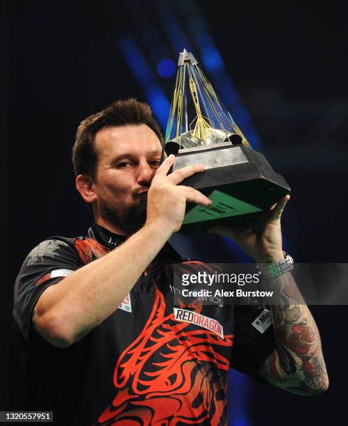 Jonny Clayton of Wales poses with the trophy after winning his Final match against Jose de Sousa of Portugal during Night 17 of the Unibet Premier...