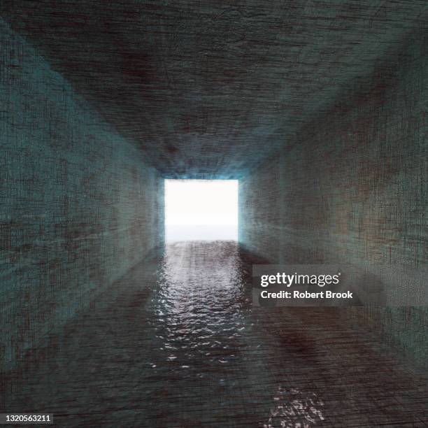 tunnel and flowing water. - breaking through wall stockfoto's en -beelden