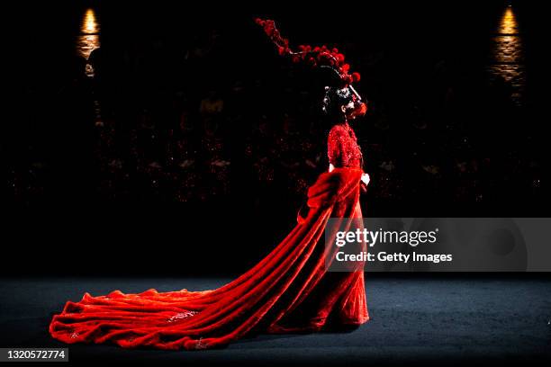 Models display new creations at the Chinese Cheongsam show of Sheguang Hu during China's 100th anniversary celebration of CPC's founding, marked with...