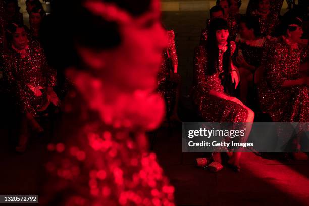 The models are backstage ready appear for the Chinese Cheongsam show of Sheguang Hu during China's 100th anniversary celebration of CPC's founding,...