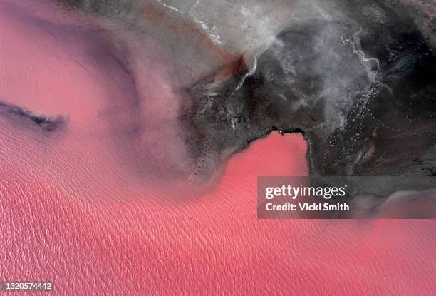 aerial view point of the multiple colors, patterns and  textures over pink lake waters with dark salty sandy soil . victoria, australia - lake victoria australia stock pictures, royalty-free photos & images