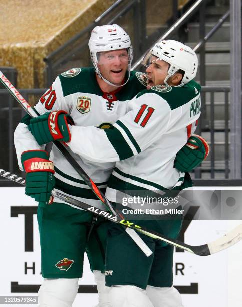 Ryan Suter and Zach Parise of the Minnesota Wild celebrate after Suter assisted Parise on a first-period goal against the Vegas Golden Knights in...