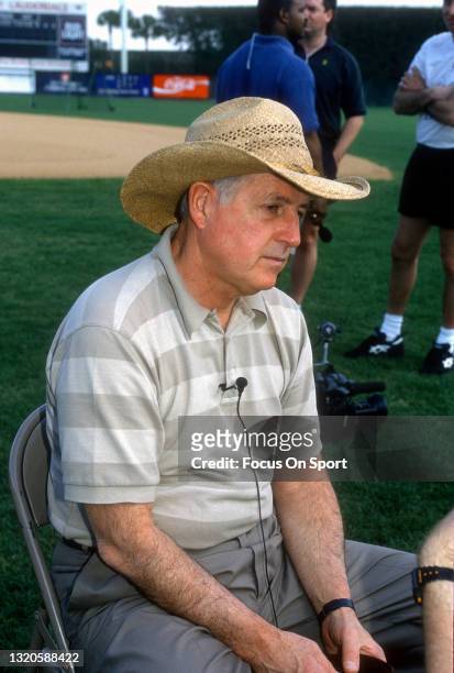 General Manager Pat Gillick of the Baltimore Orioles talks to a reporter prior to the start of Major League Baseball spring training game circa 1996....