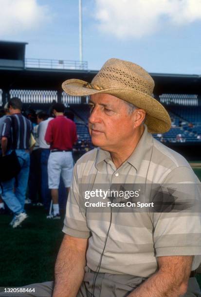 General Manager Pat Gillick of the Baltimore Orioles talks to a reporter prior to the start of Major League Baseball spring training game circa 1996....