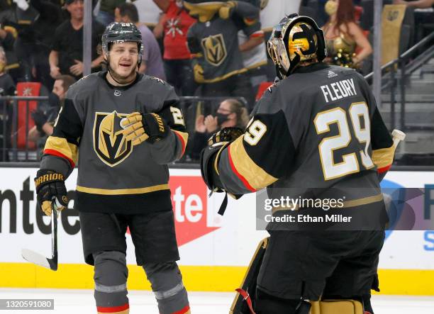 Mattias Janmark and Marc-Andre Fleury of the Vegas Golden Knights celebrate Janmark's first of his two third-period goals against the Minnesota Wild...