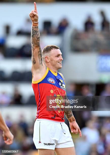 Mitch Robinson of the Lions celebrates after kicking a goal during the round 11 AFL match between the Brisbane Lions and the Greater Western Sydney...