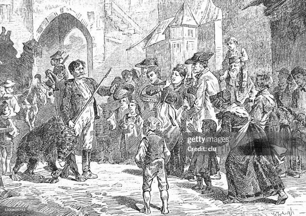 Swabian fair: Man shows a captive bear to the audience