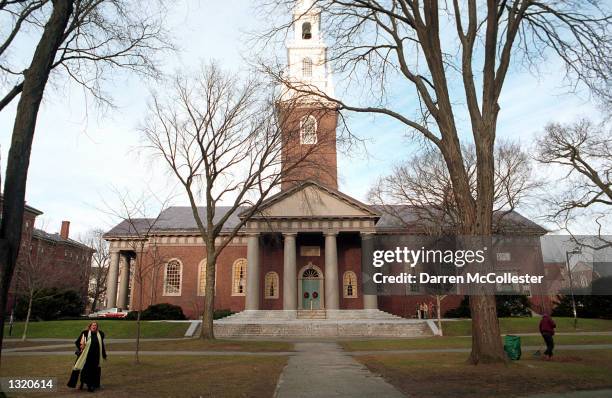 People walk around the Harvard University''s main campus December 19, 2000 in Cambridge, MA. Members of a committee searching for a new president for...