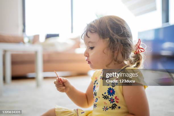 cute girl eating ice cream - blonde girl sticking out her tongue stock pictures, royalty-free photos & images