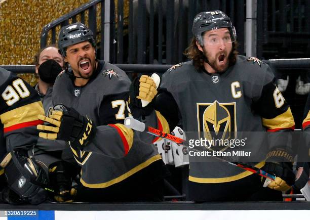Ryan Reaves and Mark Stone the Vegas Golden Knights react on the bench after Nicolas Hague scored a second-period goal against the Minnesota Wild in...