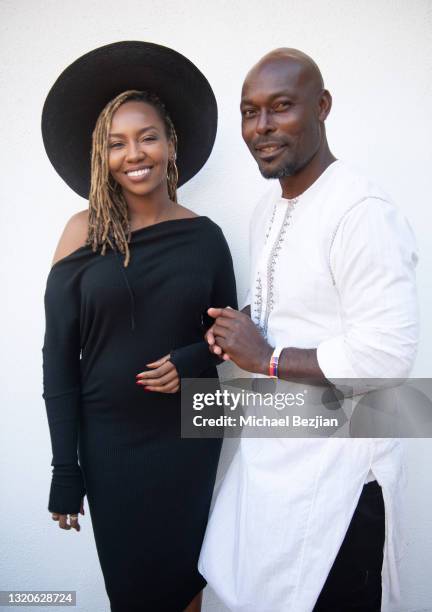Co-founder of Black Lives Matter Opal Tometi and Jimmy Jean-Louis pose for a portrait at The Artists Project Giveback Day on May 28, 2021 in Los...