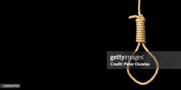 hangman's noose on black background - noose stock pictures, royalty-free photos & images
