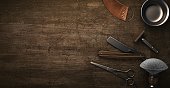 Vintage barber shop tools on wood background with place for text. 3d rendering