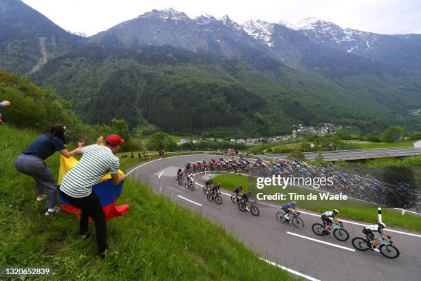 Egan Arley Bernal Gomez of Colombia and Team INEOS Grenadiers Pink Leader Jersey & The peloton passing through Mesocco mountains landscape during the...