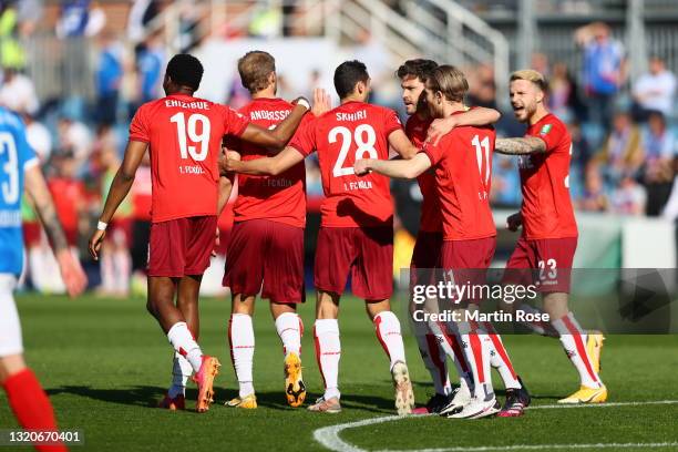 Martin Sebastian Andersson of FC Koln celebrates scoring his teams first goal of the game with team mates during the Bundesliga playoff leg two match...