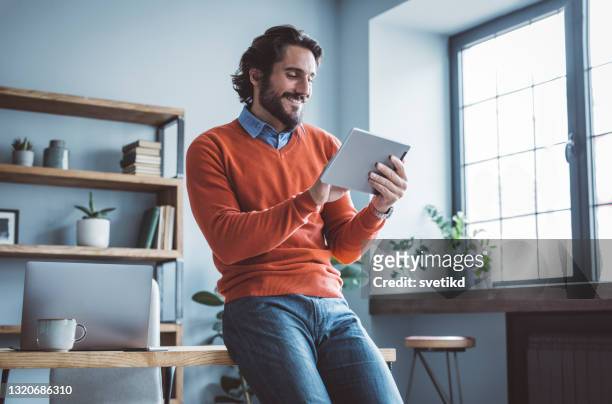 businessman working from home office - digital tablet stock pictures, royalty-free photos & images