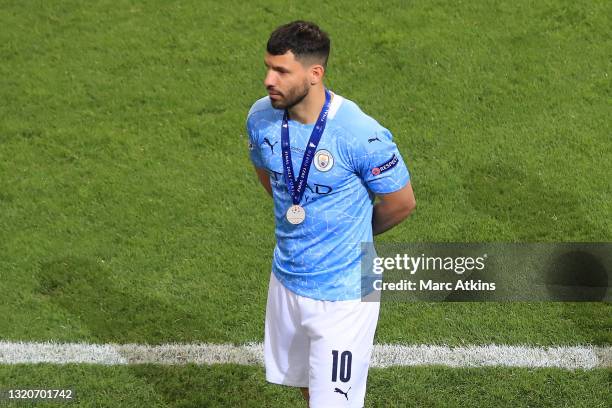 Sergio Aguero of Manchester City leaves the pitch wearing his UEFA Champions League Runners-Up Medal following his team's defeat in the UEFA...