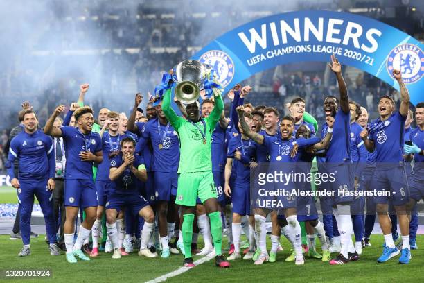 Edouard Mendy of Chelsea lifts the Champions League Trophy following their team's victory in the UEFA Champions League Final between Manchester City...