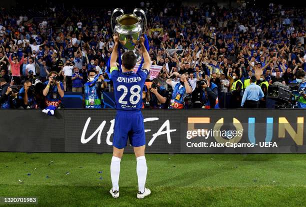 Cesar Azpilicueta of Chelsea lifts the Champions League Trophy in front of fans following their team's victory during the UEFA Champions League Final...