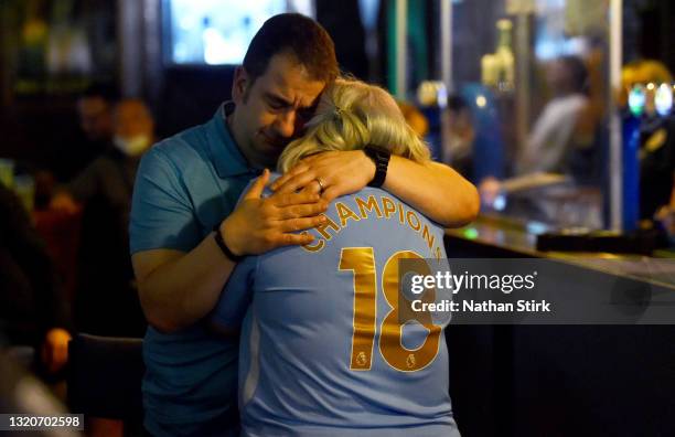 Manchester City fans react after losing the UEFA Champions League Final between Manchester City and Chelsea in a bar on May 29, 2021 in Manchester,...