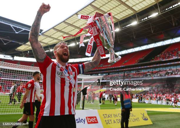 Captain Pontus Jansson celebrates with the trophy after winning the Sky Bet Championship Play-off Final between Brentford FC and Swansea City at...