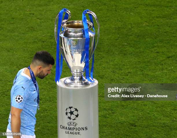 Sergio Aguero of Manchester City walks past the Champions League trophy after the UEFA Champions League Final between Manchester City and Chelsea FC...