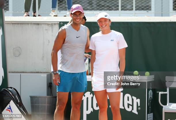 Winners of the 2020 French Open seven months ago, Rafael Nadal of Spain and Iga Swiatek of Poland practice together for 20 minutes on Court 5 ahead...
