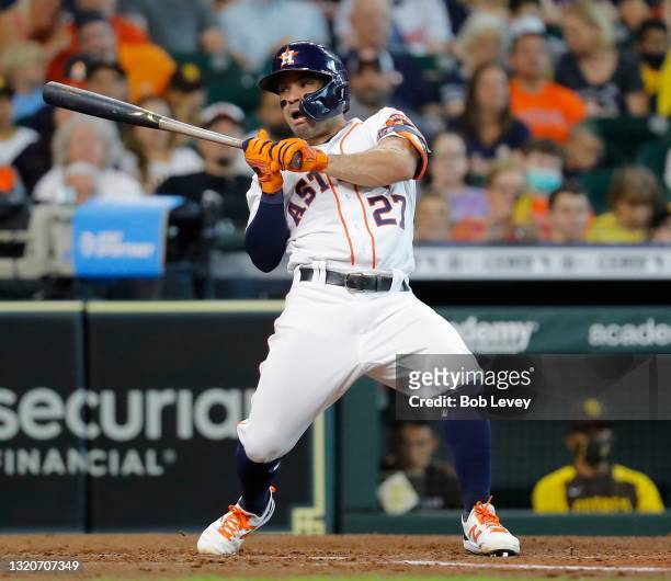 Jose Altuve of the Houston Astros is hit by a pitch in the fifth inning against the San Diego Padres at Minute Maid Park on May 29, 2021 in Houston,...