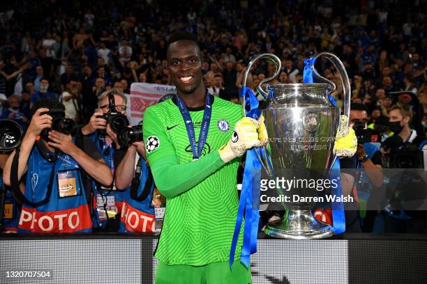 Edouard Mendy of Chelsea celebrates with the Champions League Trophy during the UEFA Champions League Final between Manchester City and Chelsea FC at...