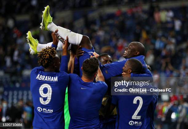 Chelsea players lift team mate Ngolo Kante of Chelsea celebrating victory in the UEFA Champions League Final between Manchester City and Chelsea FC...