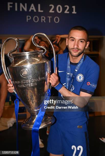 Hakim Ziyech of Chelsea poses with the Champions League Trophy following their team's victory in the UEFA Champions League Final between Manchester...